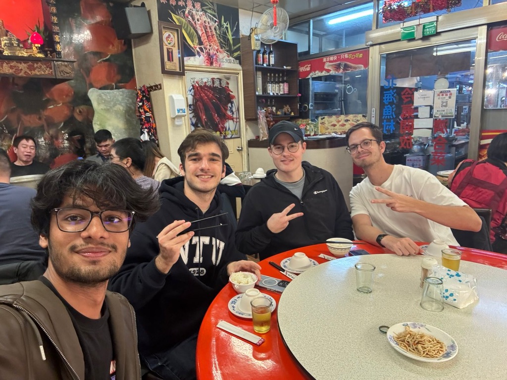 International friends gathered around a dinner table